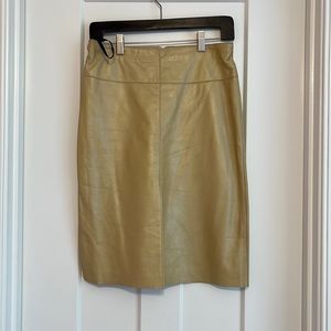 BeBe women’s leather skirt. Size 6. NWT. Tan in color. Super cute!!!